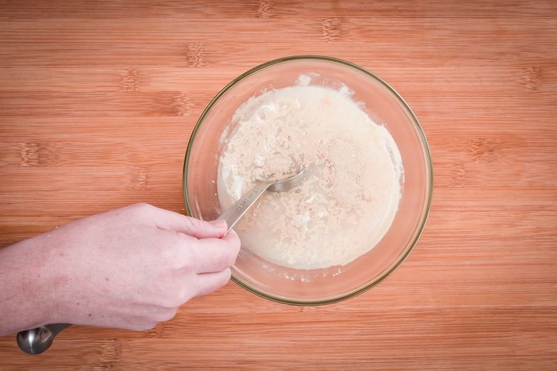 How to Make Pretzel Bread Step 2-3 Mixing yeast and water in a bowl.