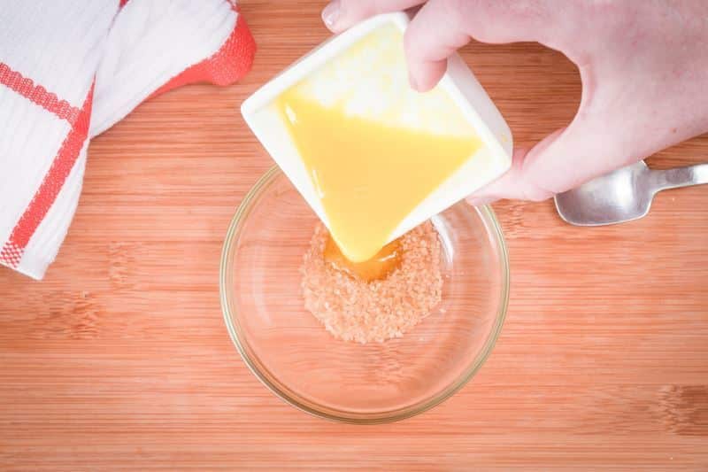 How to Make Pretzel Bread Step 3 Pouring melted butter into bowl.