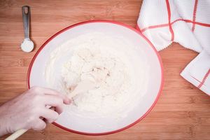 Mixing yeast and flour.