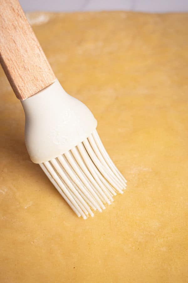 How to Make Cinnamon Rolls_14 Pastry brush and cinnamon bun pastry rolled out.