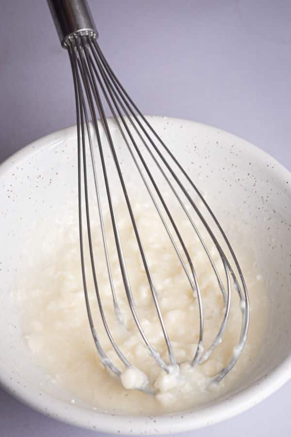 How to Make Cinnamon Rolls_4 A bowl with flour mixture and whisk.