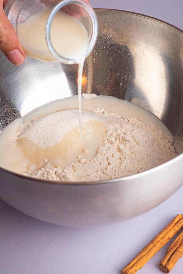 How to Make Cinnamon Rolls_6 Cinnamon bun dough ingredients in a metallic bowl.