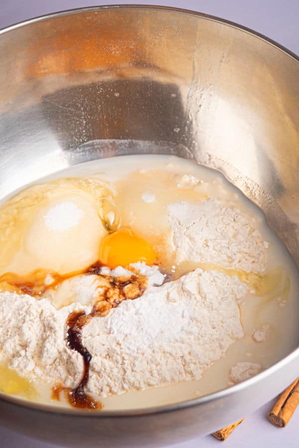 How to Make Cinnamon Rolls_8 Cinnamon bun dough ingredients in a metallic bowl.