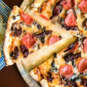 Pizza on a serving board.