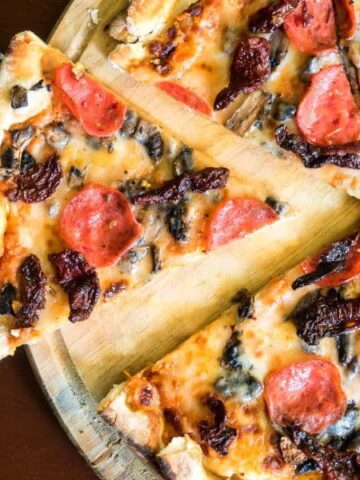 Pizza on a serving board.