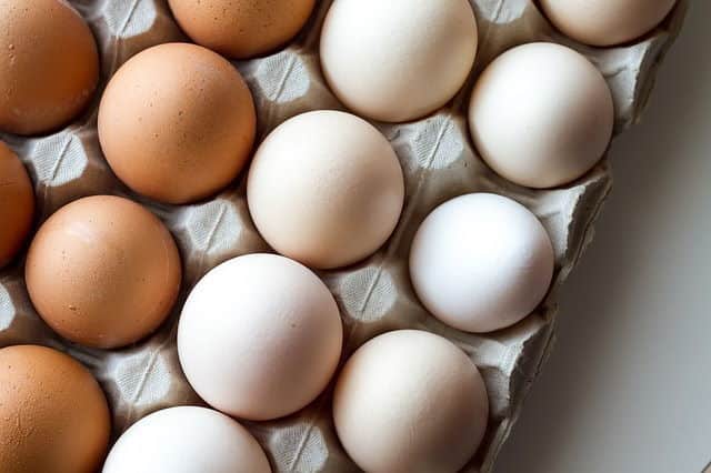 White and Brown Eggs White and brown eggs in a carton.