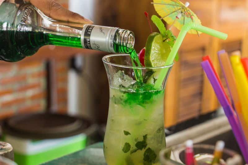 Green cocktail with umbrella. Green cocktail with umbrella.