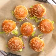 4th of July pulled pork sliders on parchment lined serving tray.