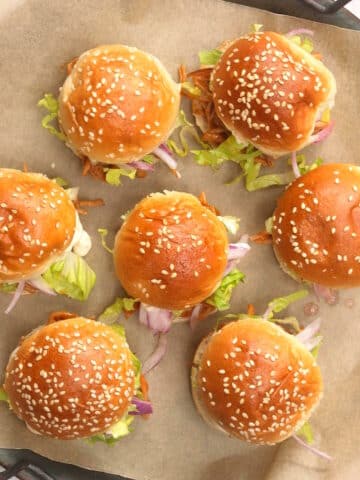 4th of July pulled pork sliders on parchment lined serving tray.