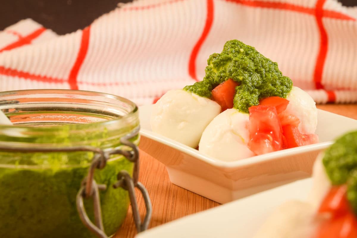 Basil pesto over tomatoes and bocconcini.