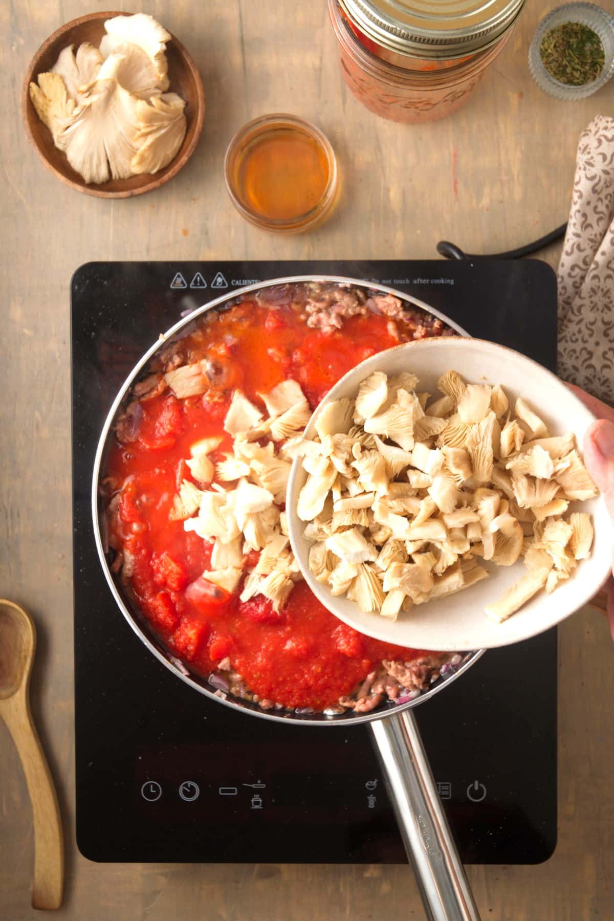 Bison meat sauce with mushrooms in a pan.