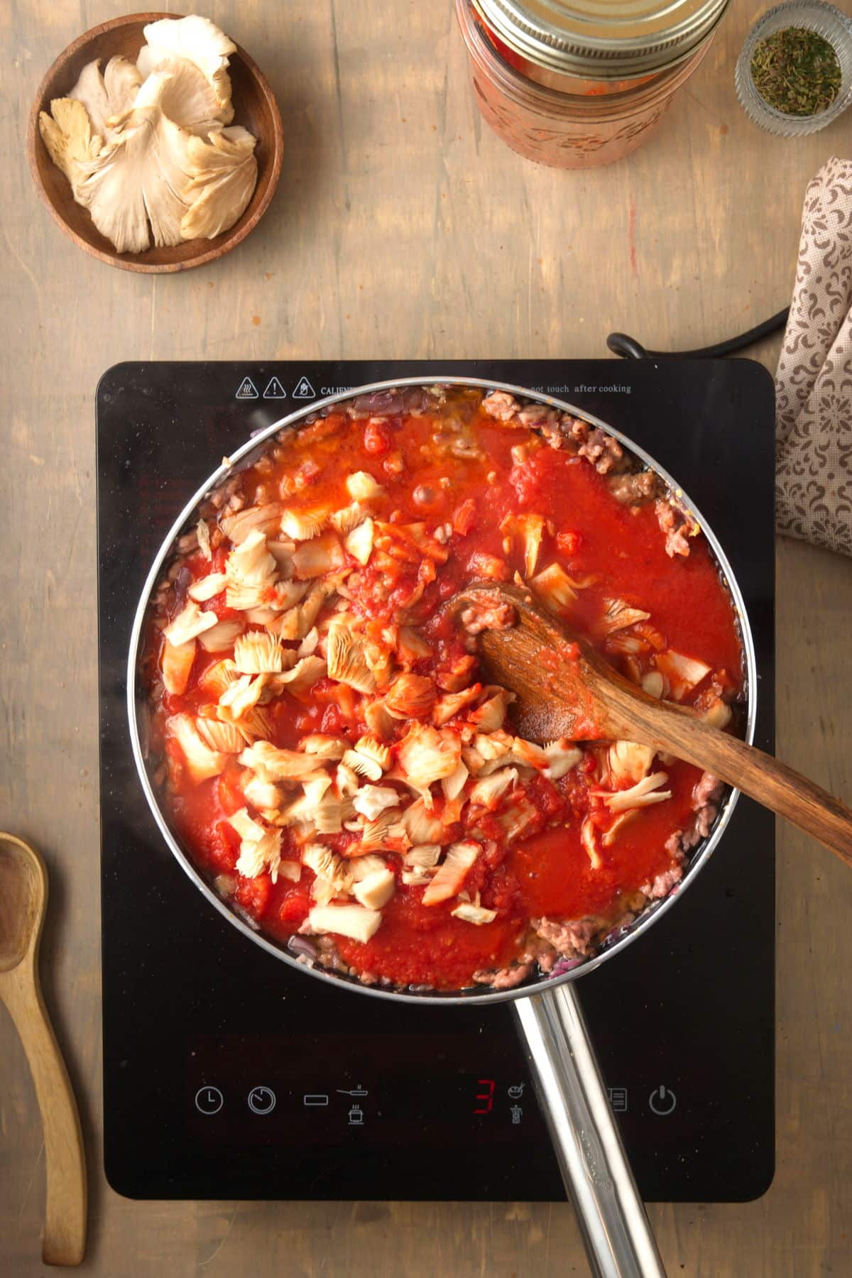 Bison meat sauce with mushrooms in a pan.