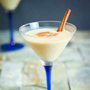 Brandy Alexander cocktail in a martini glass with blue stem.
