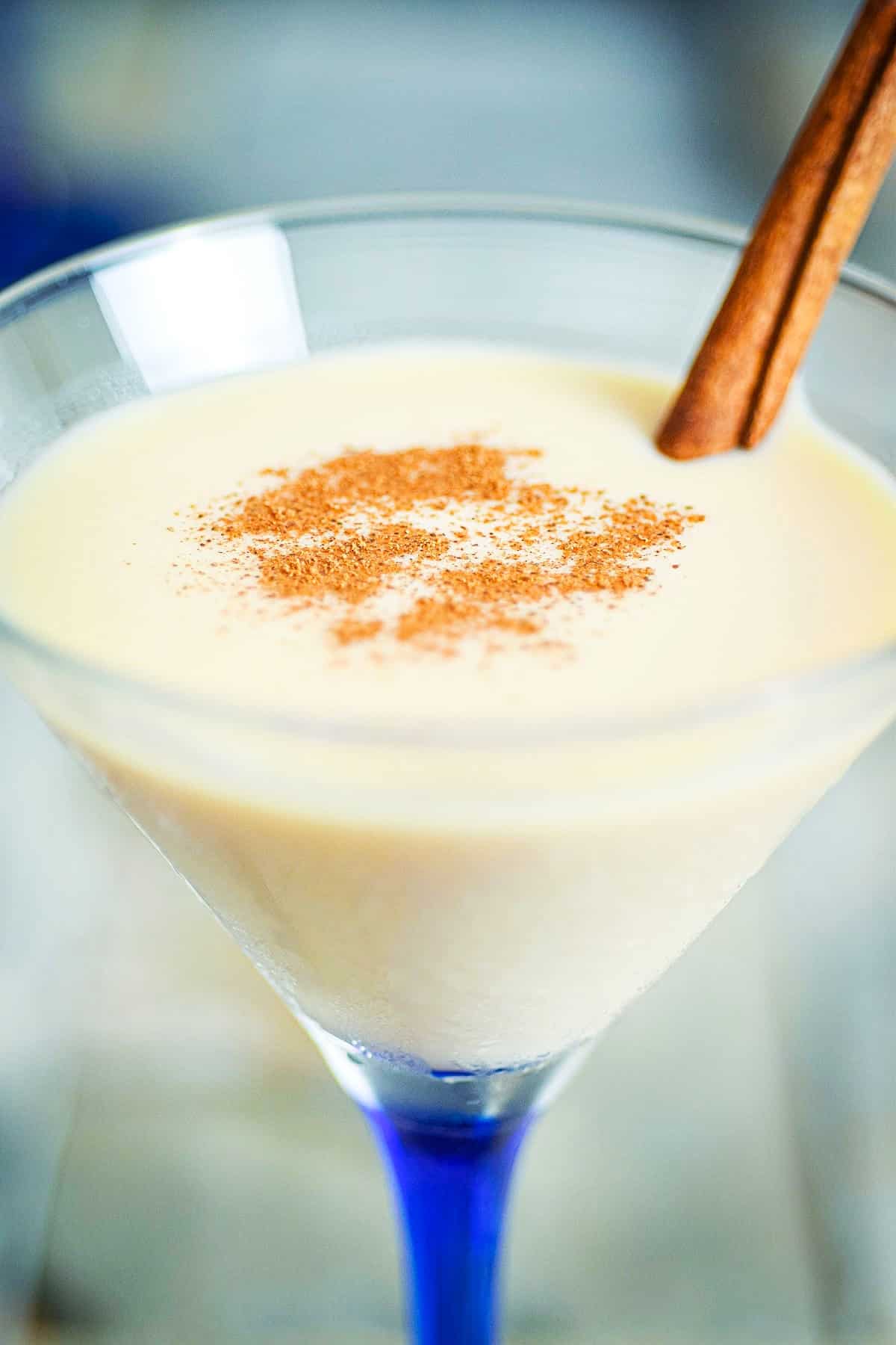 Brandy Alexander cocktail in a martini glass with blue stem.
