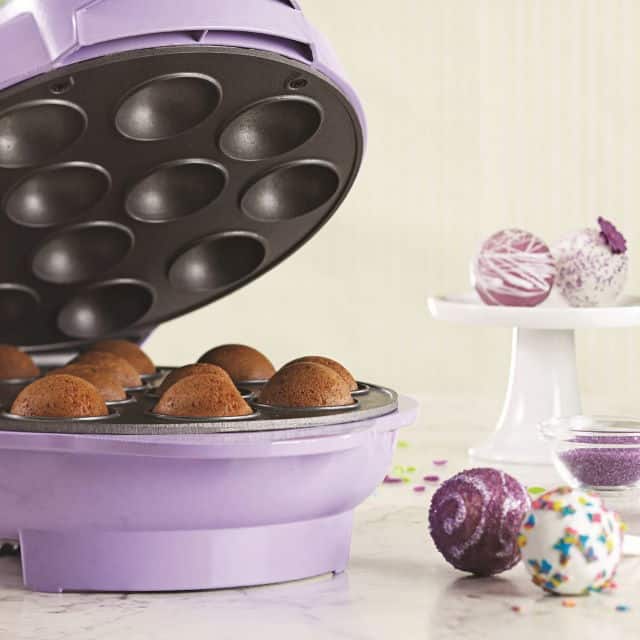 Brentwood Cake Pop Maker Purple 2 Purple Brentwood cake pop maker with lid open, cake balls on the side.