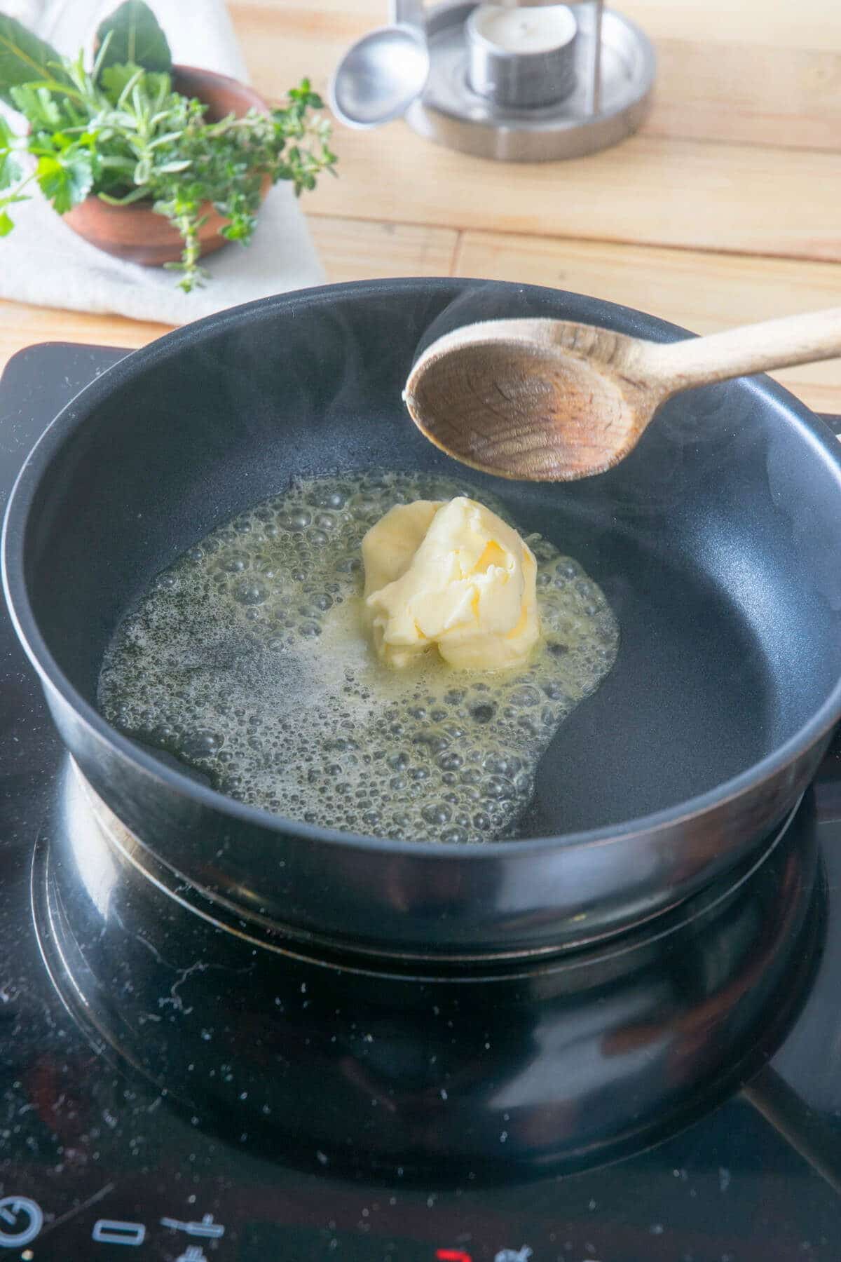 Butter melting in frying pan.