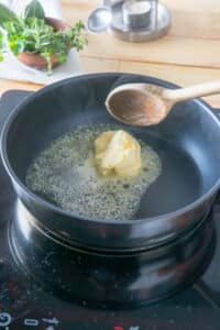 Butter melting in frying pan.