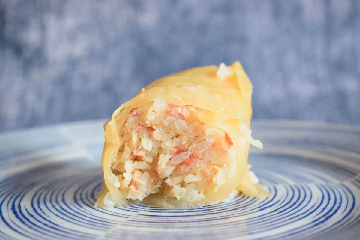 Cooked cabbage roll cut open.