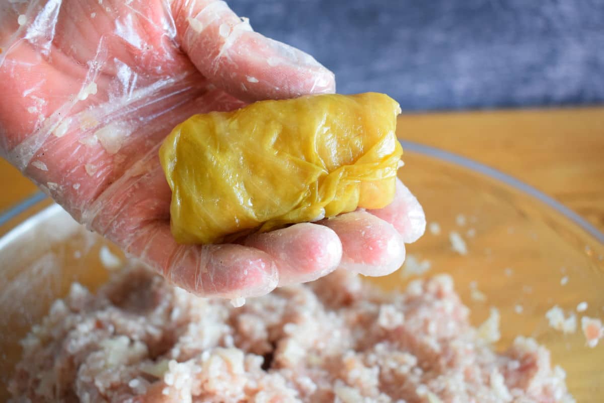 Cabbage roll in hand.