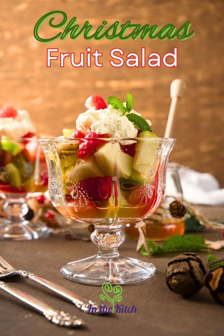 Fruit salad in a clear glass dessert dish.