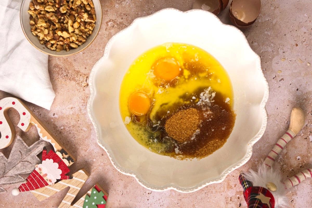 Christmas bundt cake wet ingredients in bowl.