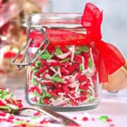Christmas sprinkles in jar with red ribbon.