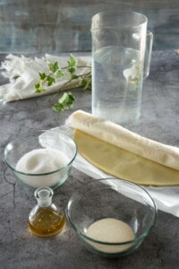 Clear pumpkin pie ingredients on concrete style background.