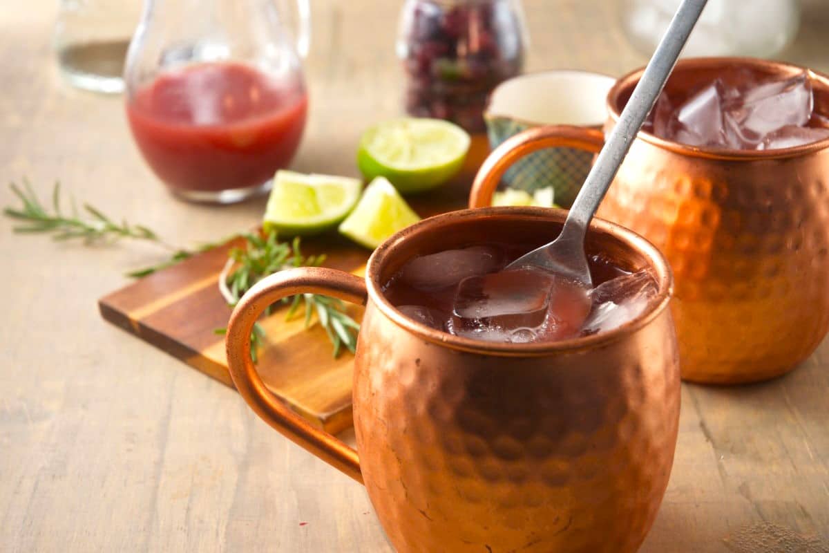 Ice and spoon in copper mug.