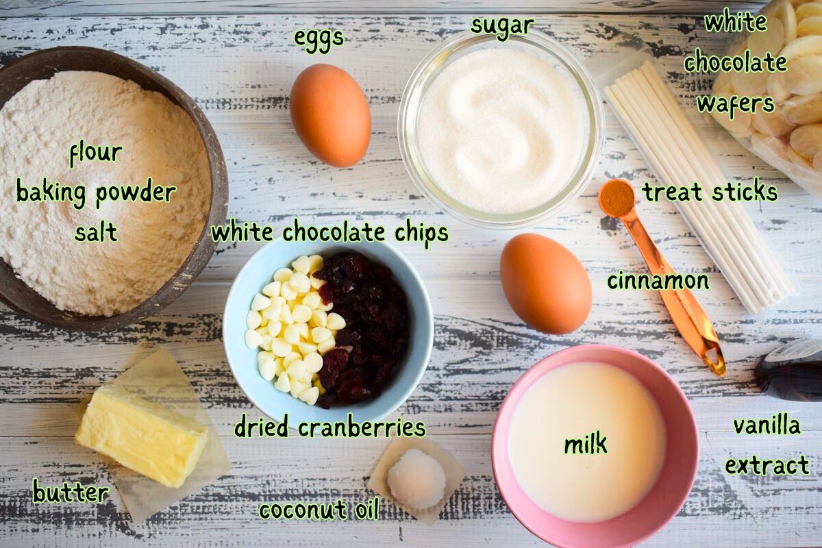 Cranberry white chocolate cake pops ingredients prepped on white wooden background.