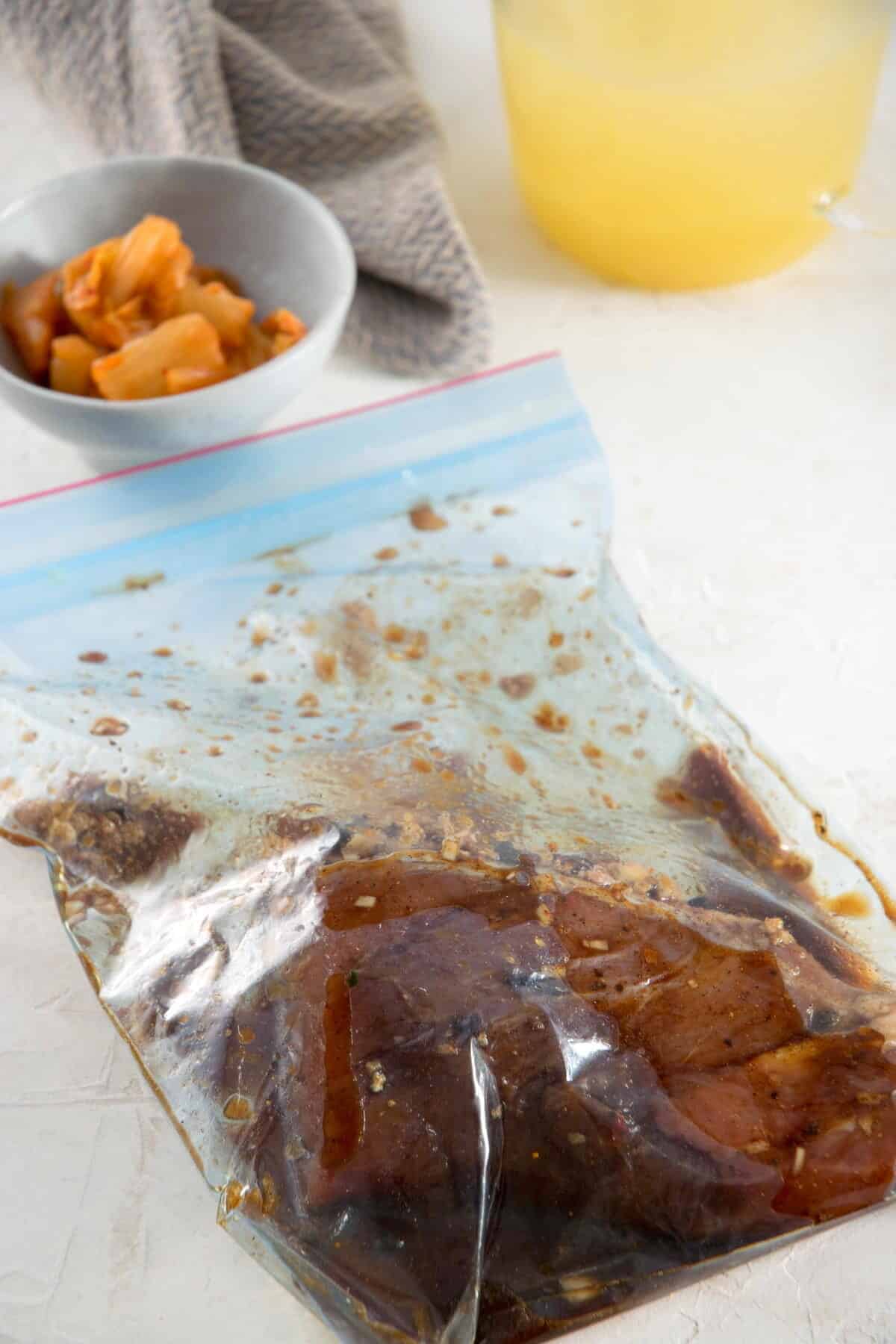 A ziptop bag with pork tenderloin and marinade.