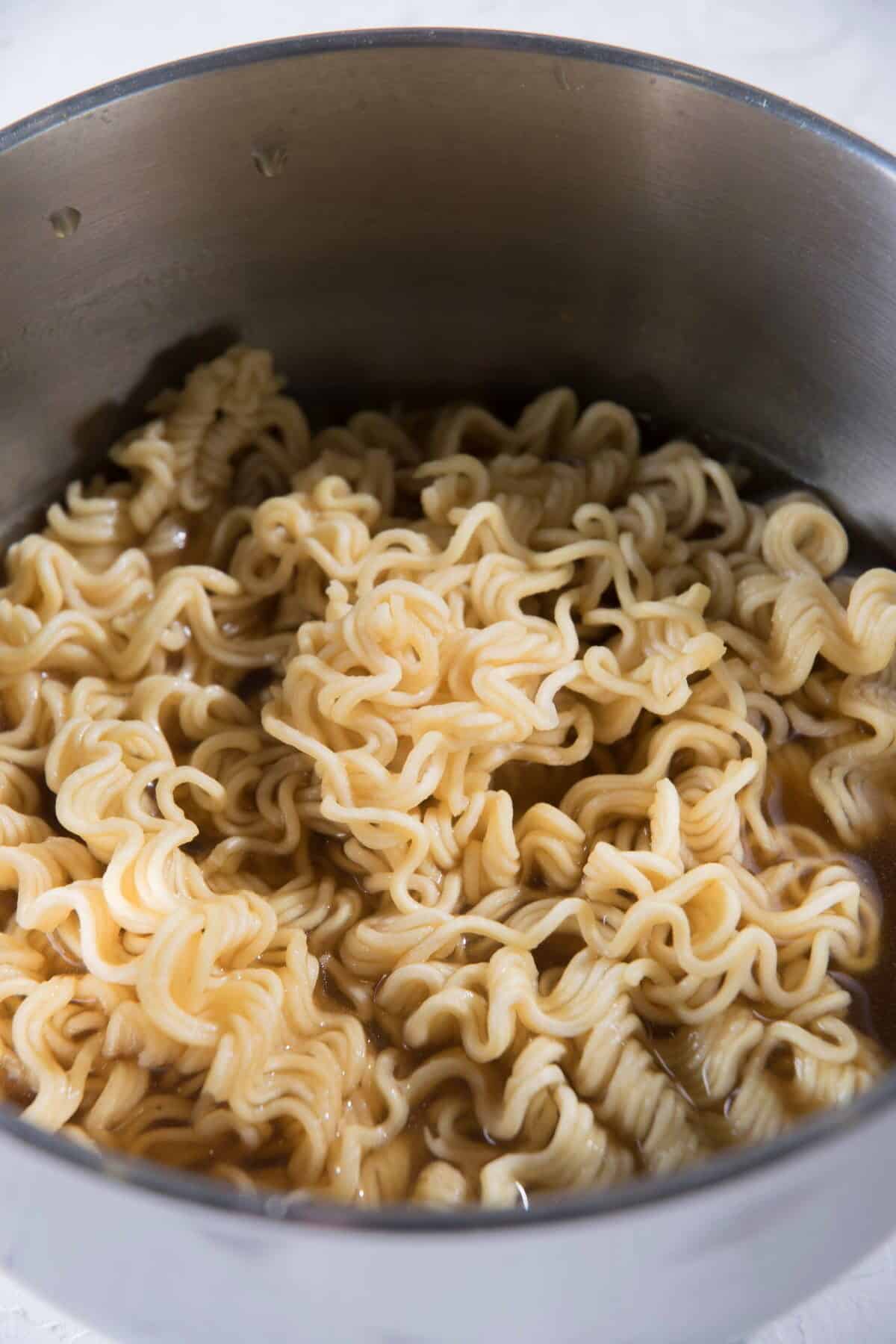 Instant ramen noodles in a pot.