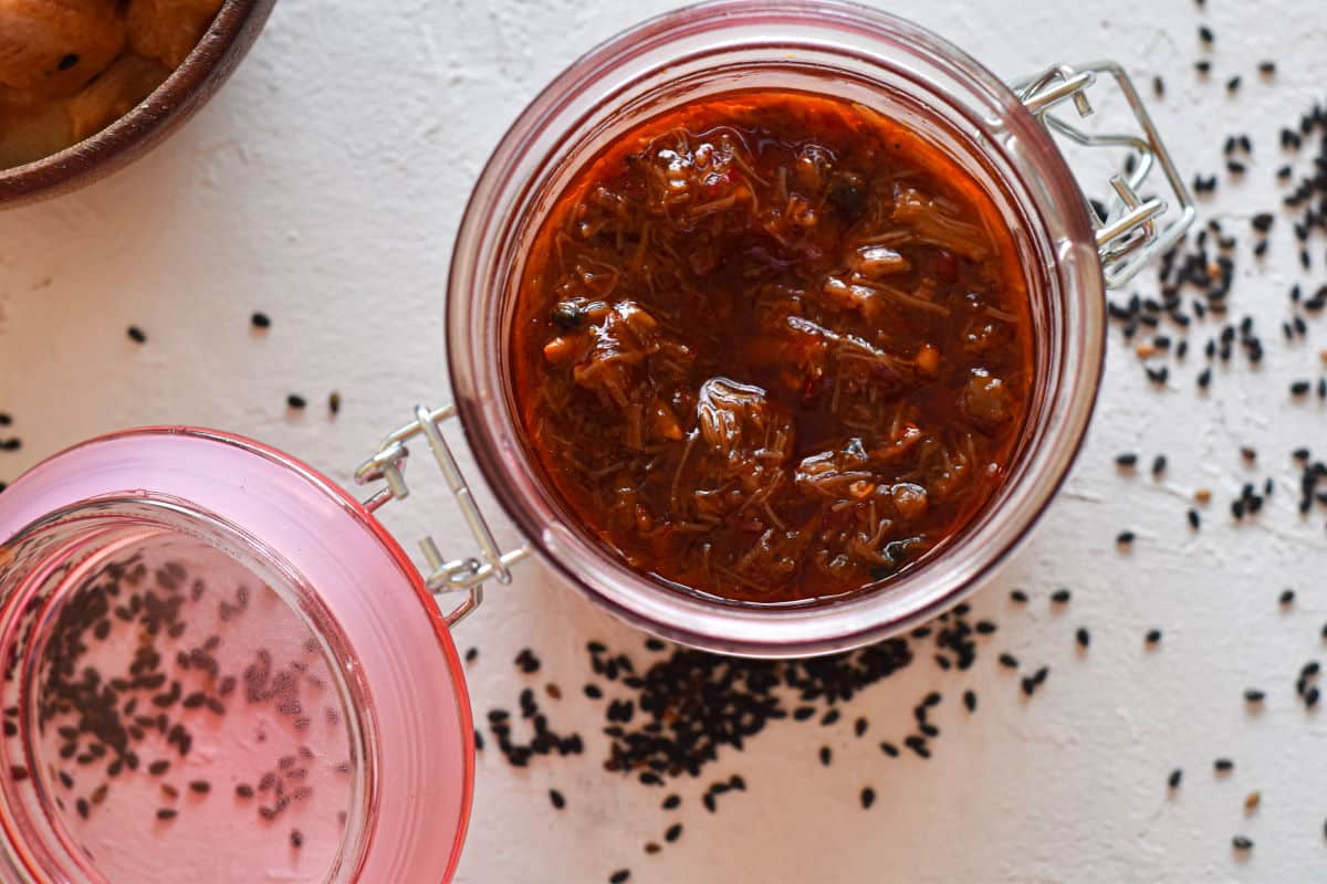 XO sauce in a jar on white background.