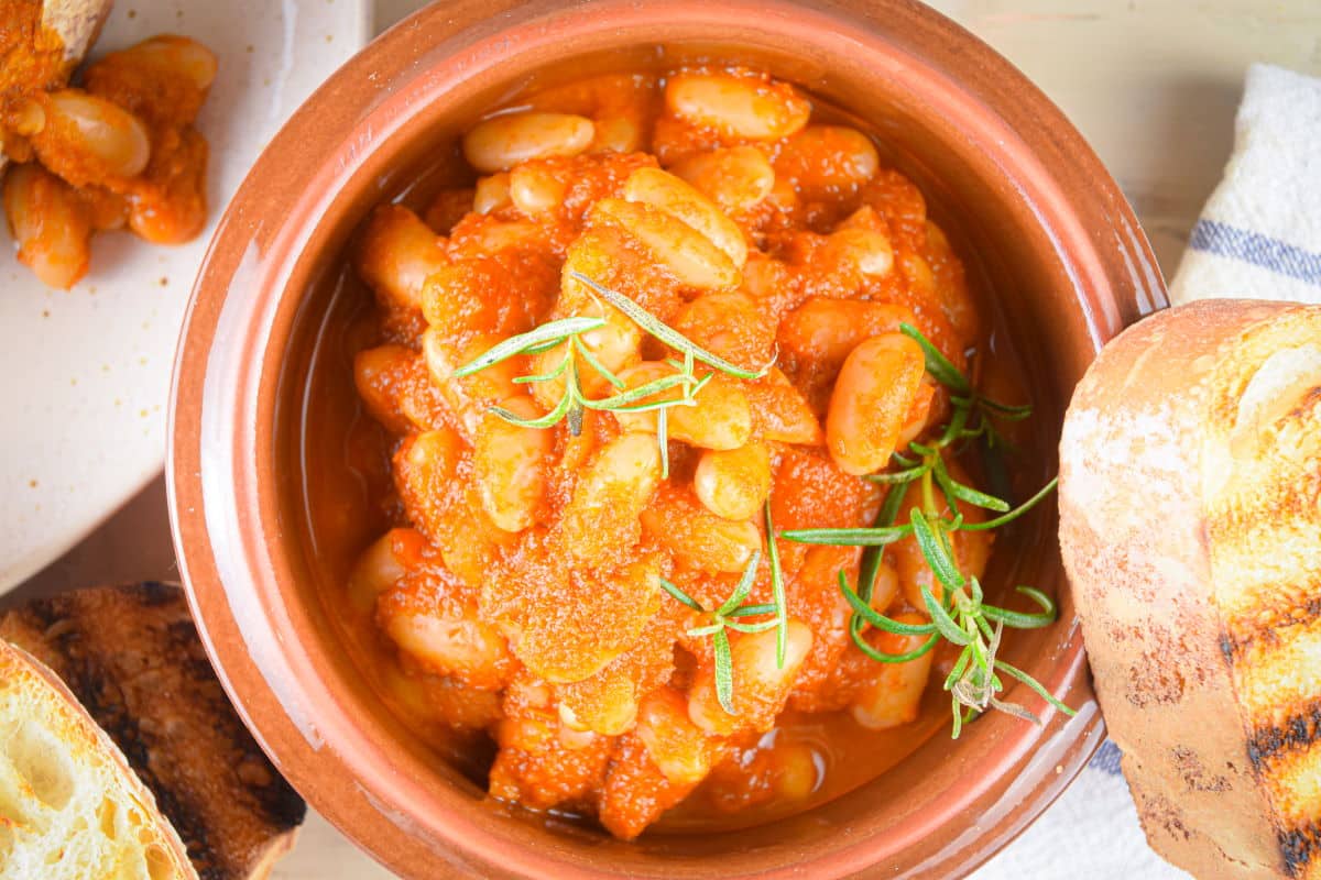 British baked beans in bowl with toast on the side.
