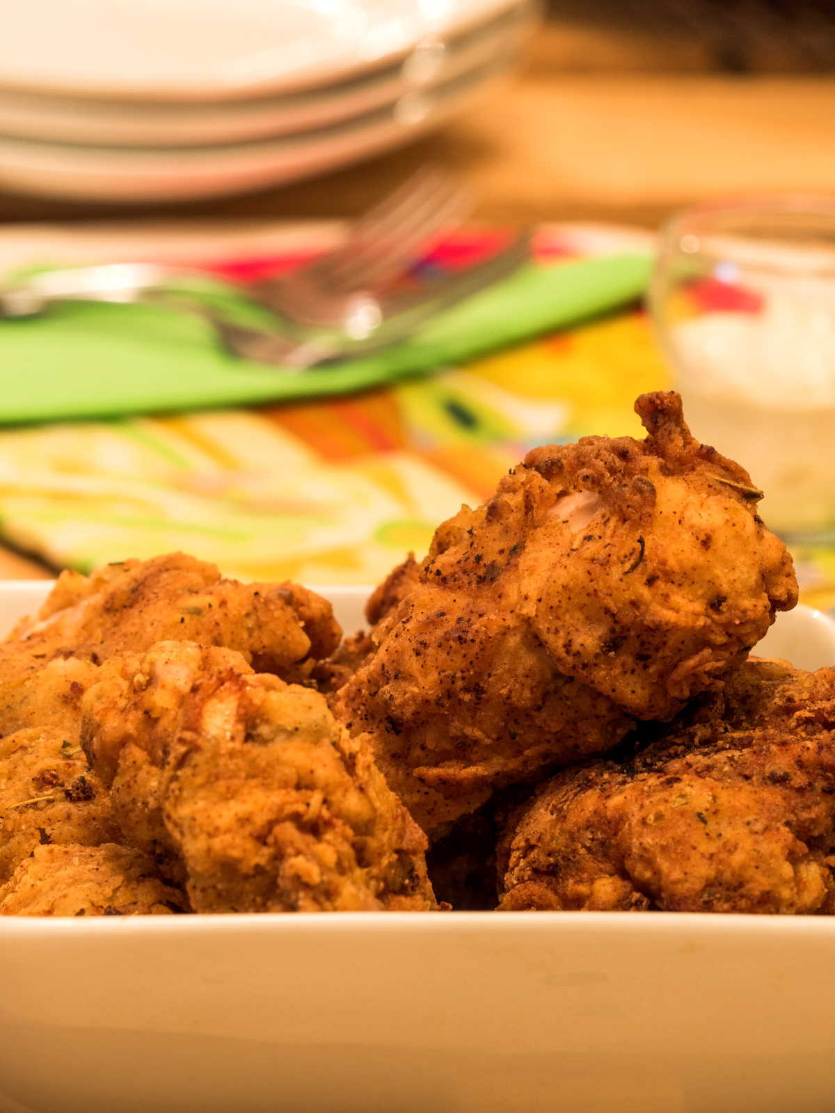 Electric Skillet Fried Chicken 4 - IntheKitch Electric skillet fried chicken in porcelain dish with garlic mayo on the side.