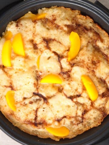 Peach cobbler in electric skillet.