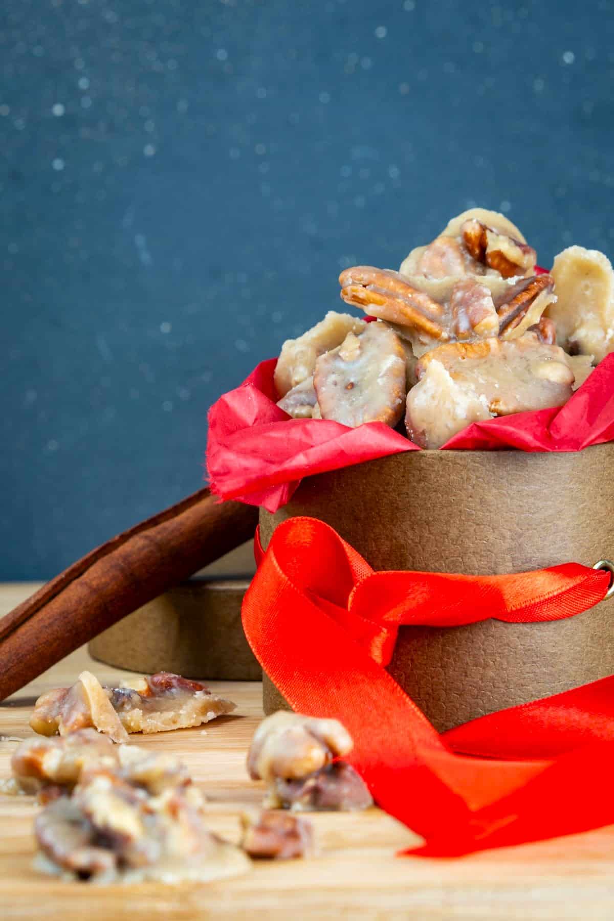 How to Make Pralines Final 2 Praline pecans in gift box with red ribbon.