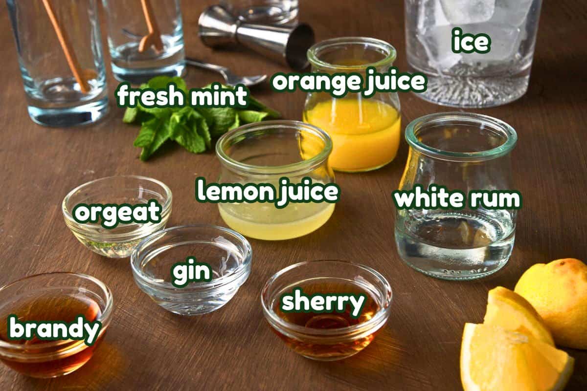 Fog cutter cocktail ingredients prepped and labeled.