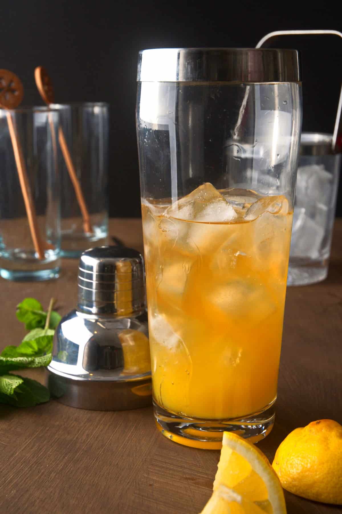 Fog cutter in cocktail shaker with ice.