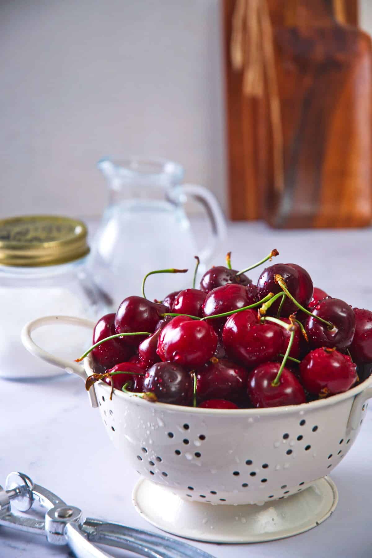 Cleaned whole cherries in colander.