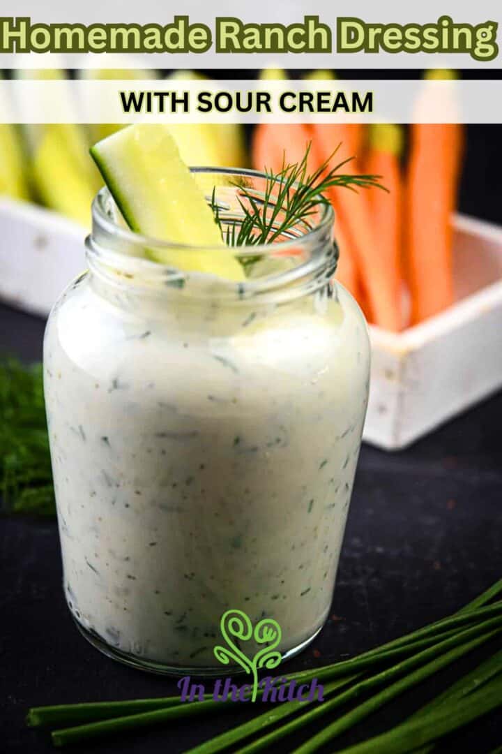 Ranch dressing in small jar with vegetable sticks and text overlay that says 'homemade ranch dressing with sour cream'.