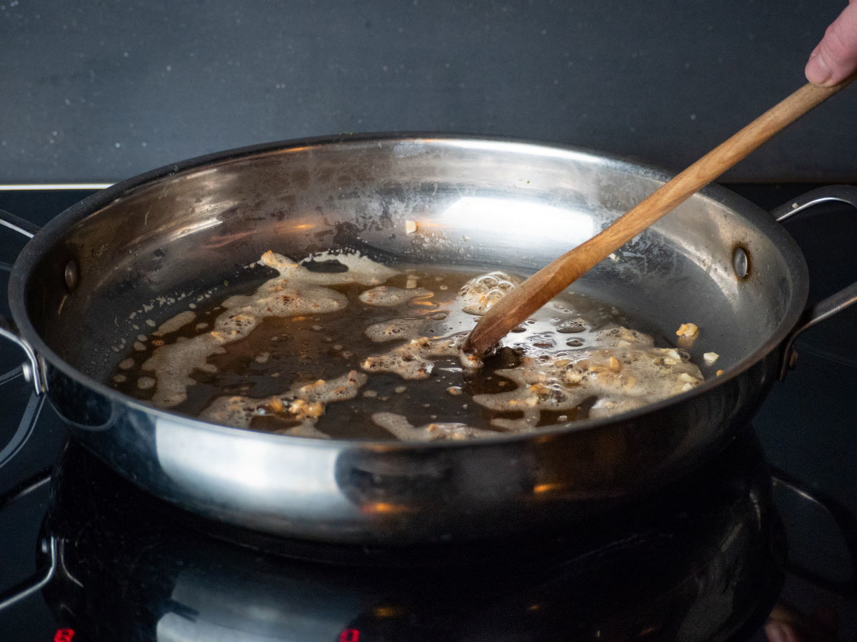 How to Cook Asparagus on the Stove - Step 7 Garlic and olive oil in a frying pan.