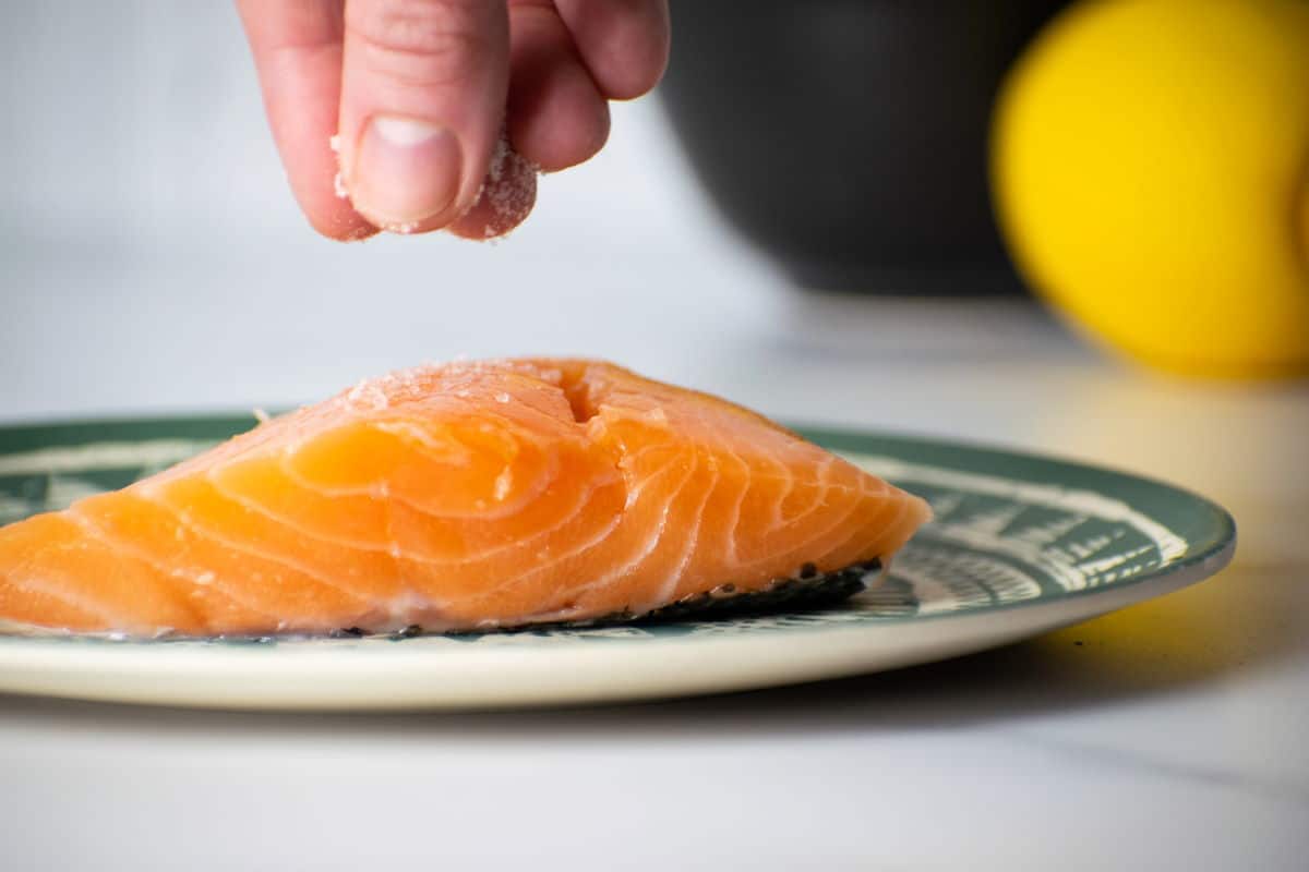 How to Cook Salmon With Skin Step 2 Salt sprinkled on salmon fillets.