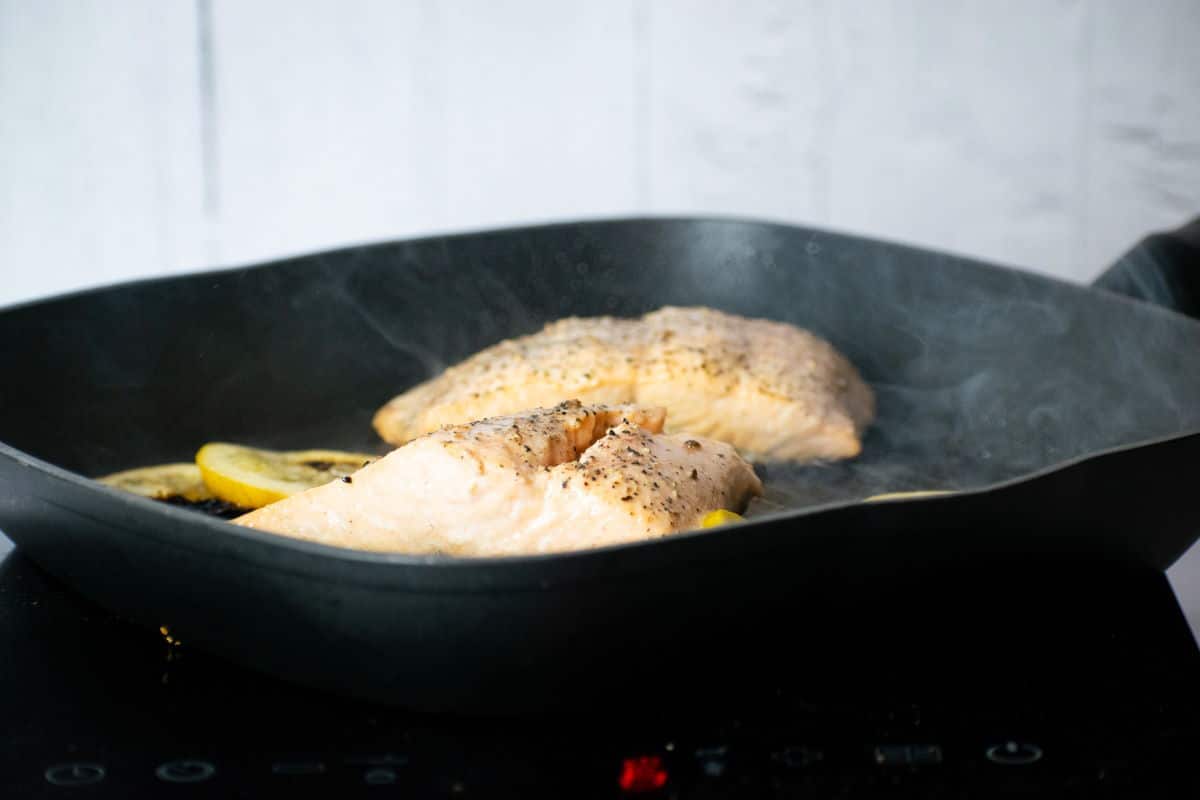 How to Cook Salmon With Skin Step 7 Cooked salmon fillets in pan.