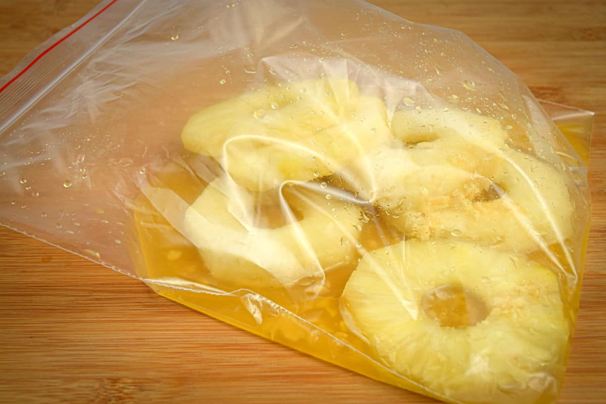 How to Grill Pineapple Slices_6 Marinated pineapple slices in a zip top bag.
