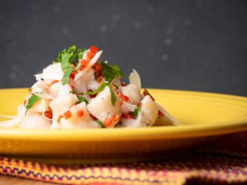 Ceviche on a yellow plate.