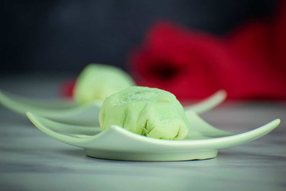 How to Make Mochi Ice Cream Step 9-4 Mochi ice cream ball on small plate.