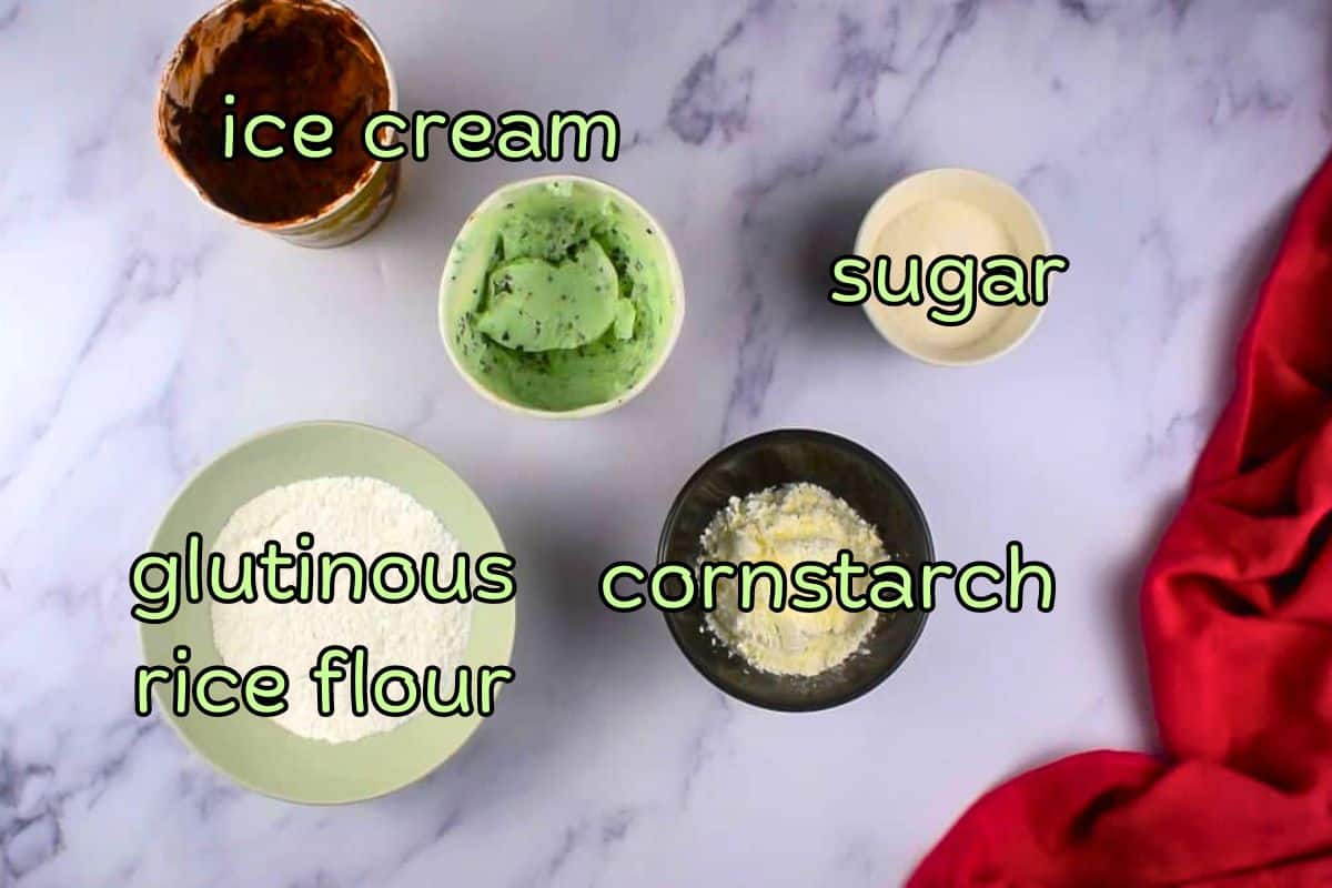 Mochi ice cream ingredients prepped and labeled on marble background.
