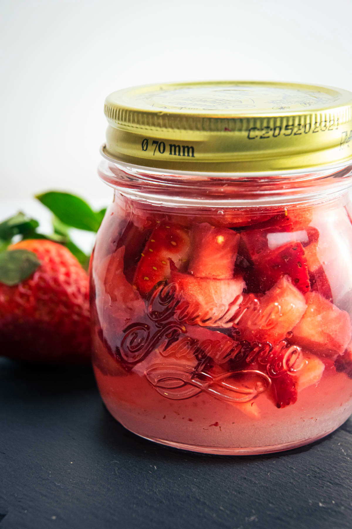 Vodka, strawberries and sugar in a closed jar.