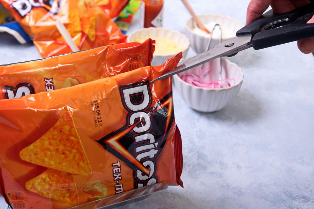 A small bag of Doritos with scissors.