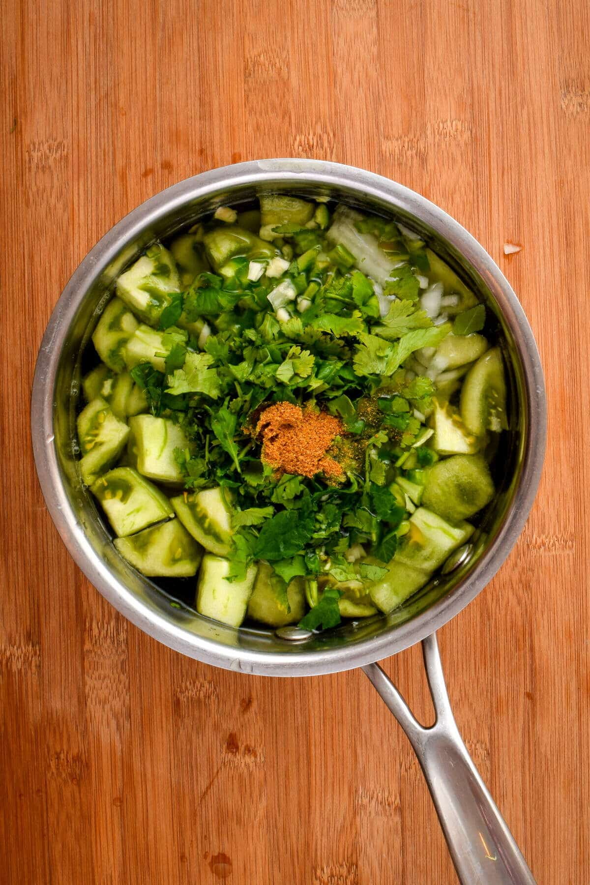 How to Make Tomatillo Salsa_7 Tomatillo salsa ingredients in a pot of water.